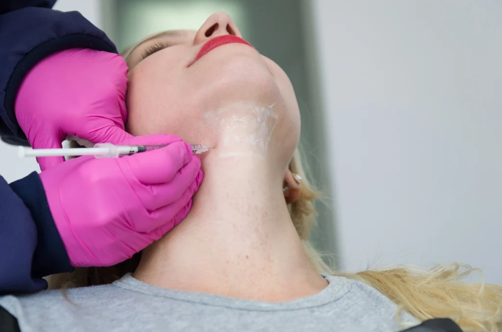 Esthetician injecting Kybella under chin | RejuvLV Wellness & Aesthetics | Las Vegas NV