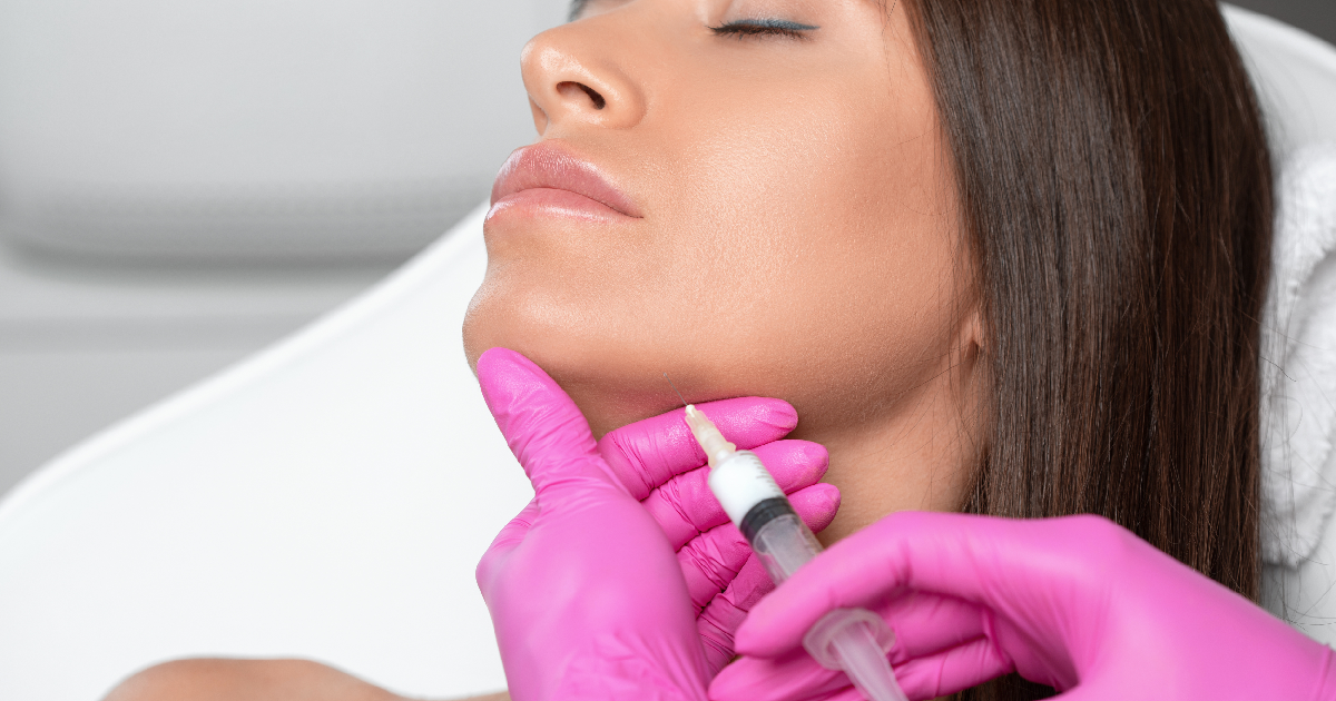 Woman receiving Kybella injection under chin in Las Vegas, NV